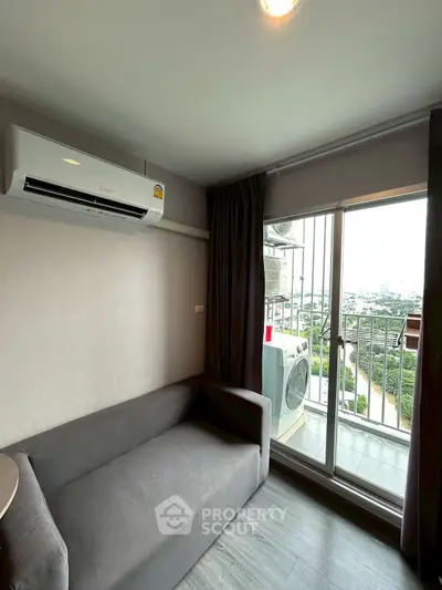 Cozy living room with balcony view and air conditioning