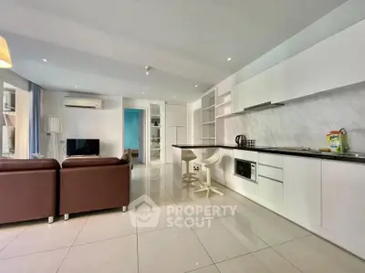 Spacious modern living room with open kitchen and sleek design