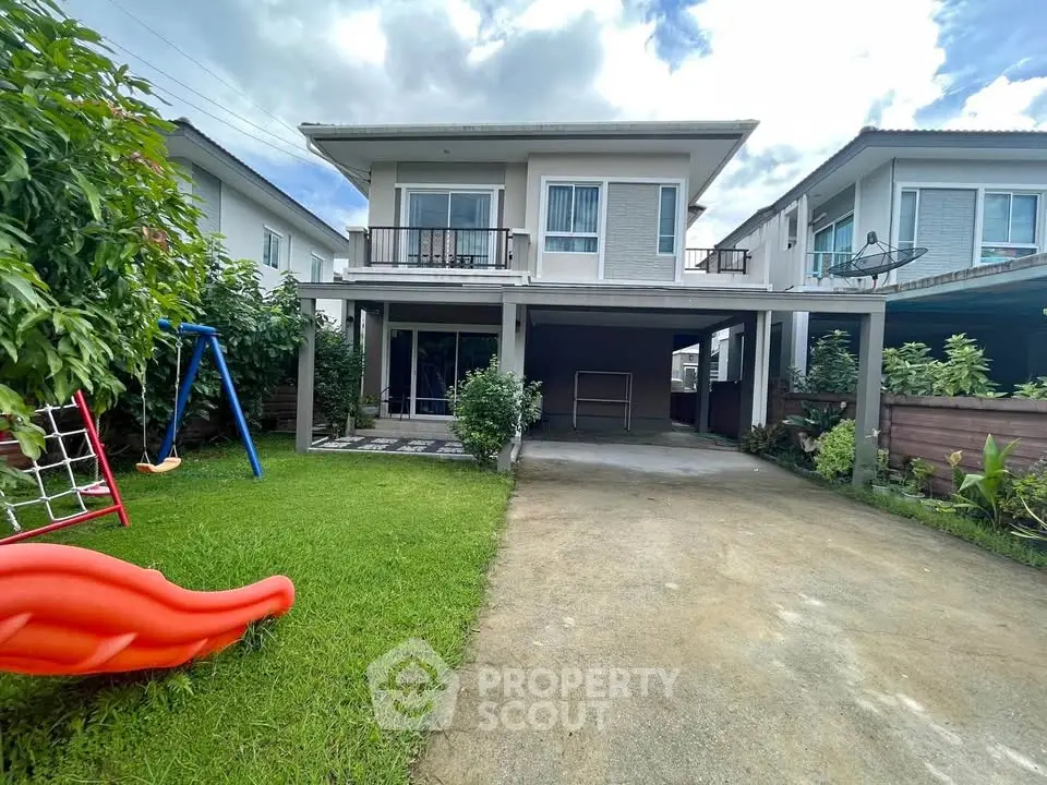 Charming two-story house with lush garden and spacious driveway in a serene neighborhood.