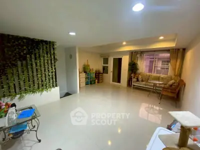 Spacious living room with modern decor and natural light