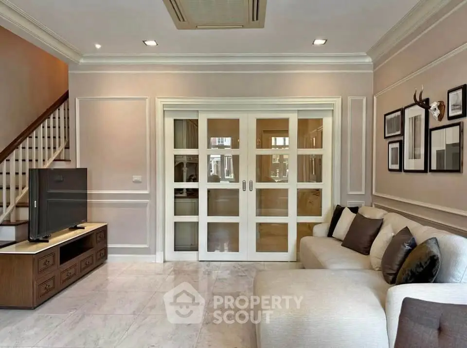 Elegant living room with sliding glass doors and cozy sectional sofa