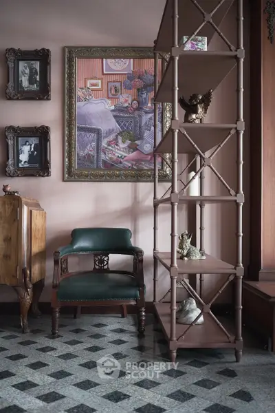 Charming vintage interior with elegant chair, decorative shelving, and classic artwork, perfect for cozy living spaces.