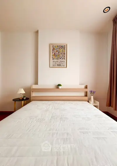 Cozy bedroom with minimalist decor and natural light