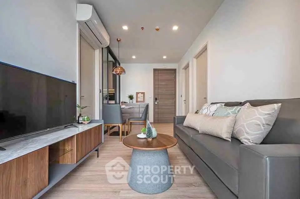 Modern living room with sleek furniture and stylish decor in a contemporary apartment.