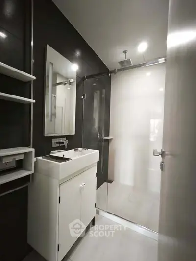 Modern bathroom with sleek design and glass shower enclosure
