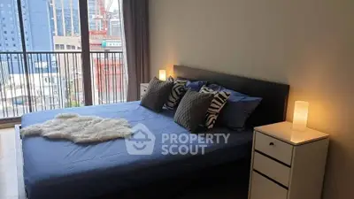 Modern bedroom with city view and stylish decor