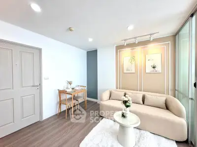 Modern living room with cozy beige sofa and elegant dining area in stylish apartment.