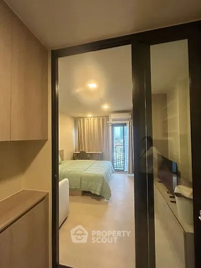 Modern bedroom with sliding glass doors and balcony view