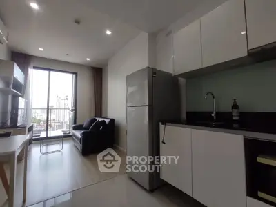 Modern apartment living room with sleek kitchen and city view