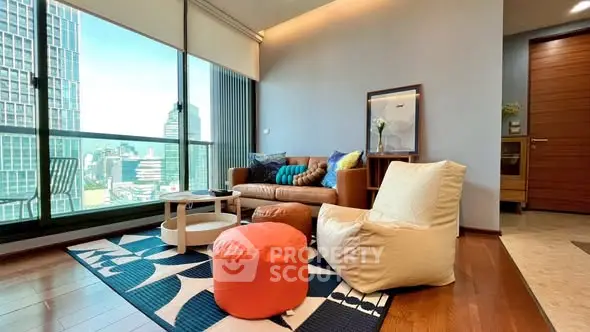 Modern living room with city view, stylish furniture, and large windows.