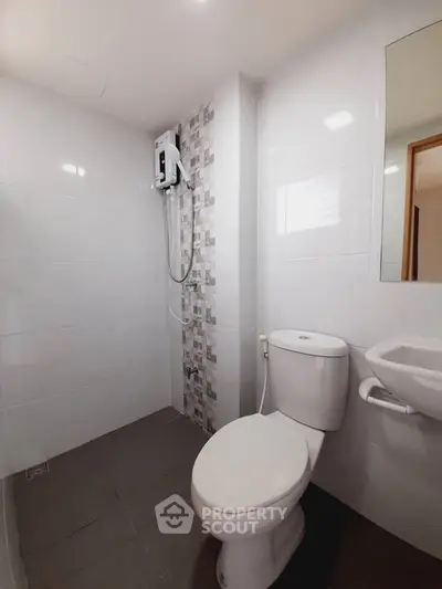 Modern bathroom with sleek white tiles and compact design