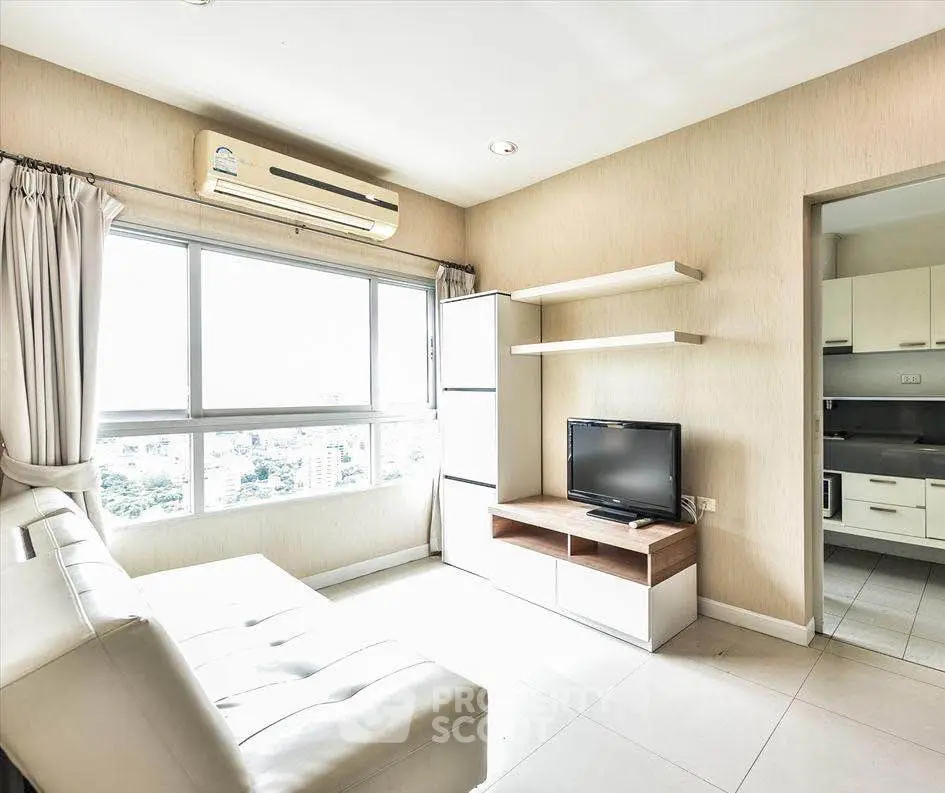 Bright modern living room with large window and sleek furniture