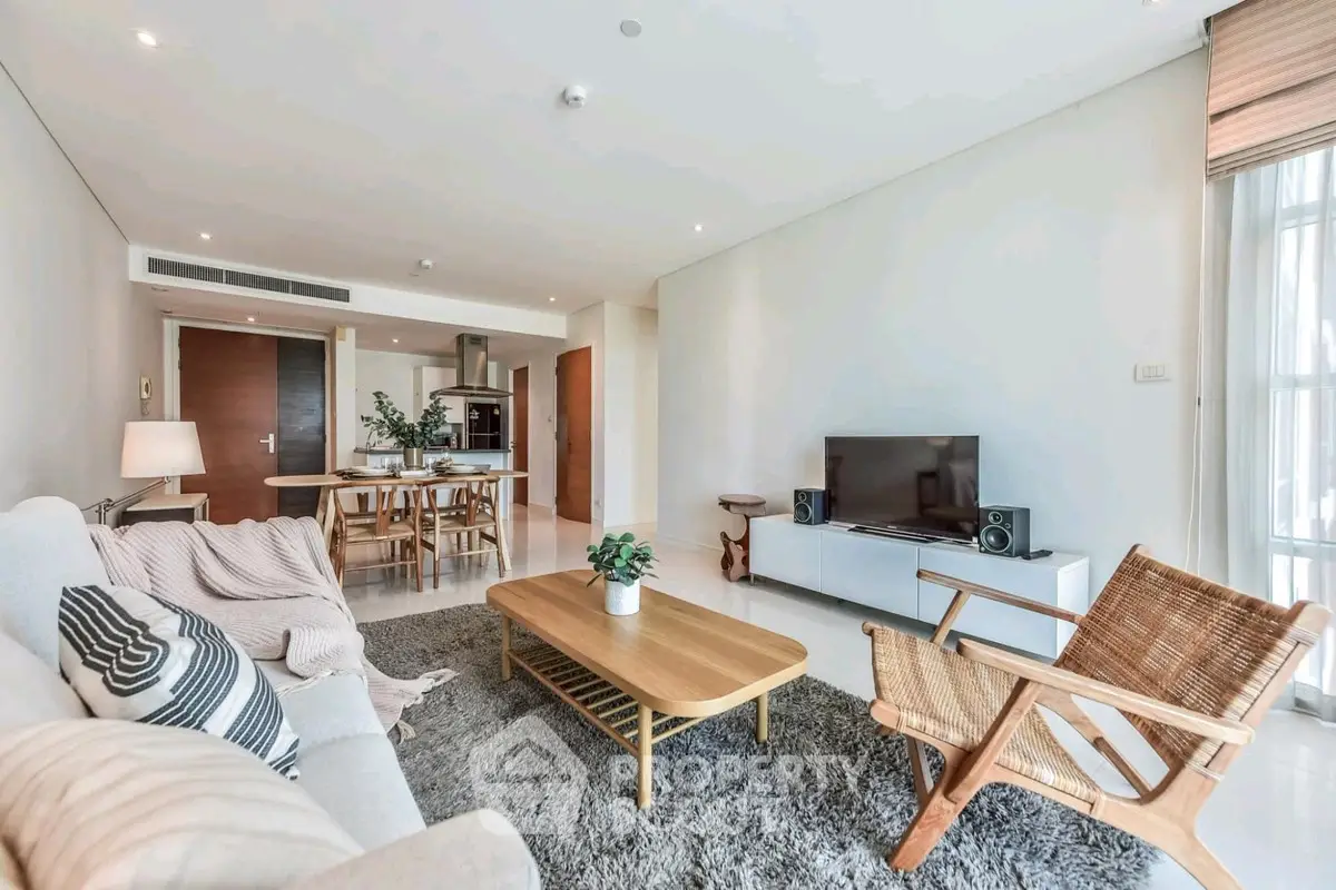 Spacious modern living room with cozy furniture and open layout