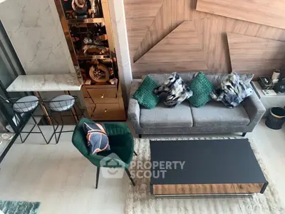 Stylish modern living room with elegant furniture and unique wall design