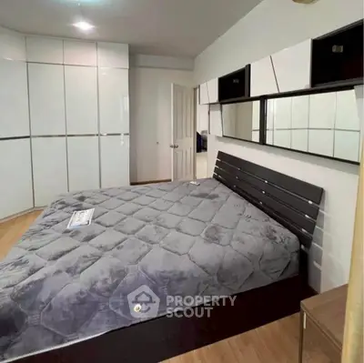 Modern bedroom with sleek design and ample storage space