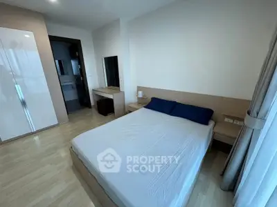 Modern bedroom with wooden flooring and minimalist furniture design