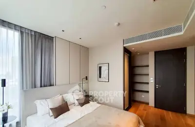 Modern bedroom with stylish decor and ample natural light