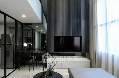 Modern living room with high ceiling and sleek design