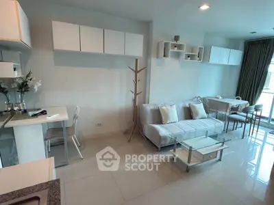 Modern living room with sleek furniture and open layout, perfect for urban living.
