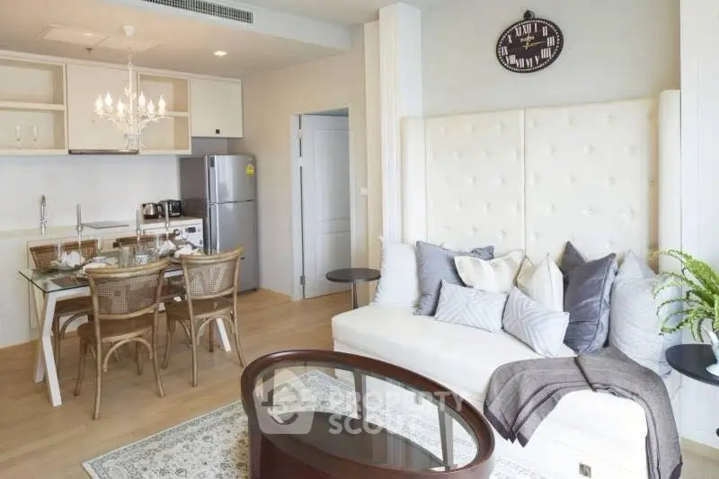 Stylish open-plan living room with modern kitchen and elegant decor