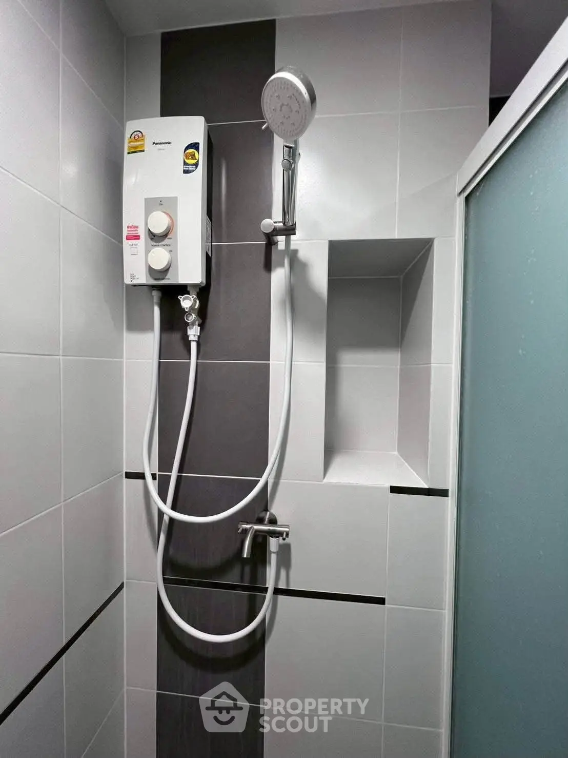 Modern bathroom with sleek shower unit and stylish tile design