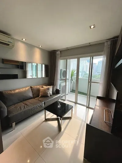 Modern living room with sleek design and balcony view in urban apartment
