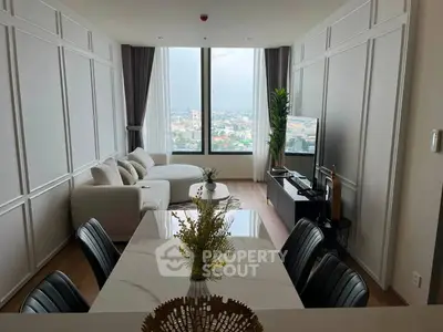 Spacious modern living room with panoramic city view and elegant decor