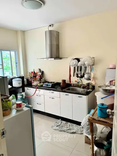 Cozy kitchen with modern appliances and ample storage space.