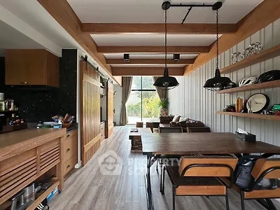 Chic industrial-style living room with wooden beams and modern decor