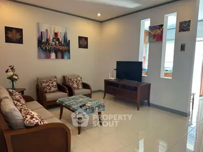 Spacious living room with modern decor and natural light