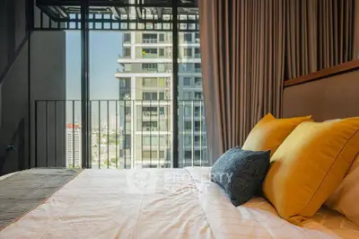 Luxurious bedroom with city view and stylish decor in modern apartment.