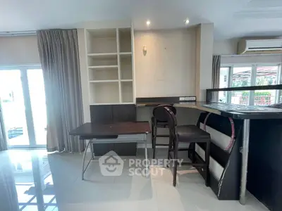Spacious interior with modern bar counter and shelving, ideal for stylish living.
