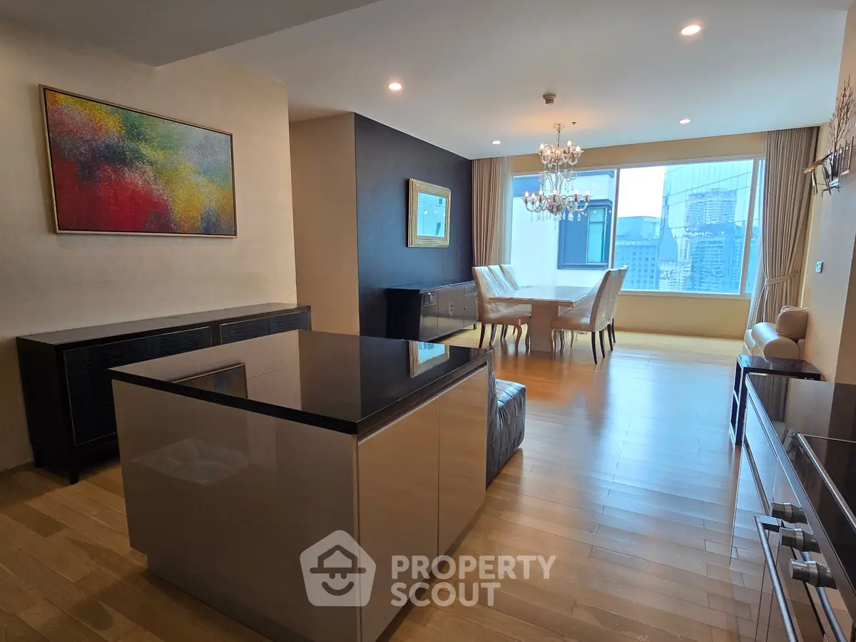 Luxurious open-plan living and dining area with city view, elegant decor, and modern furnishings.