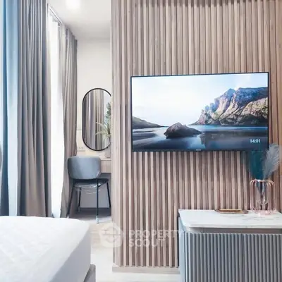 Modern bedroom with wall-mounted TV and stylish decor