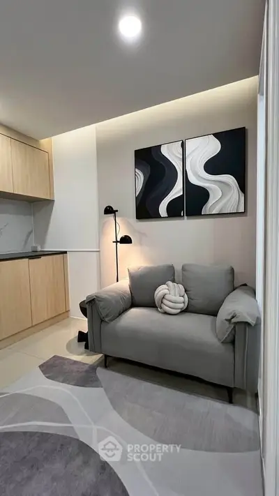 Modern living room with stylish decor and cozy seating area.