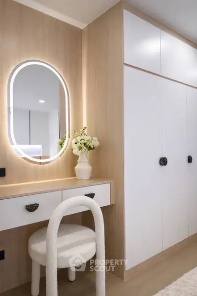 Elegant modern bedroom with stylish vanity and built-in wardrobe