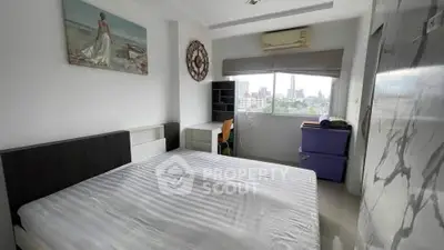 Modern bedroom with city view, featuring sleek furniture and stylish decor.