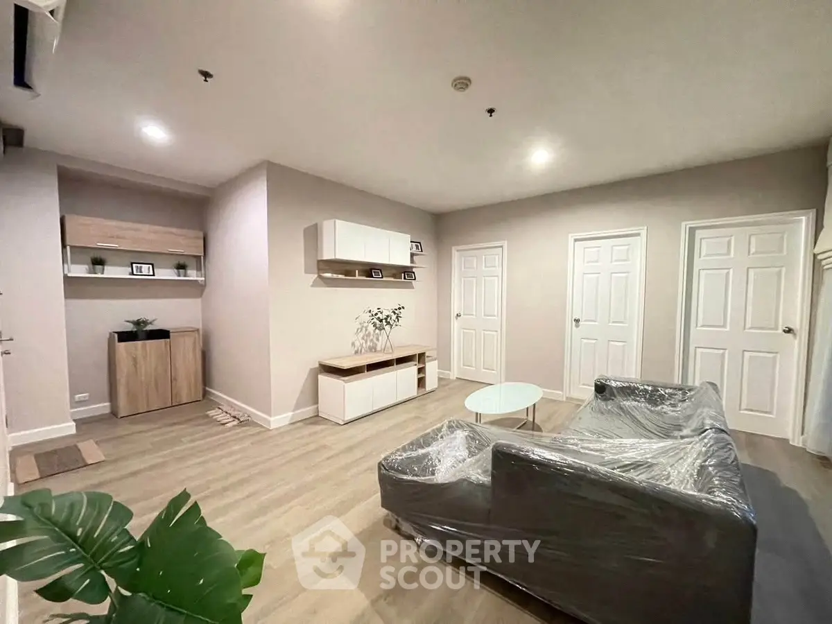 Modern living room with sleek furniture and stylish decor in a contemporary apartment.