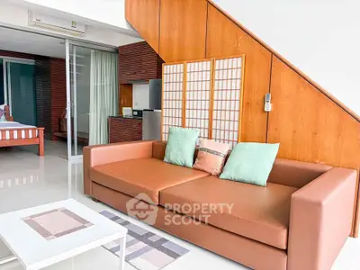Modern living room with stylish sofa and wooden accents in a contemporary apartment