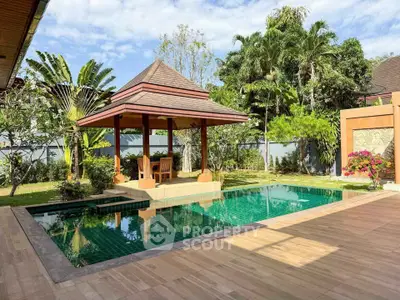 Luxurious tropical villa with private pool and gazebo surrounded by lush greenery, perfect for relaxation.
