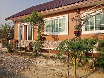 Charming single-story home with lush garden and modern windows.