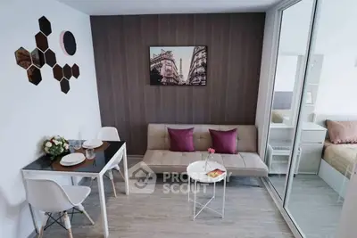 Modern living room with stylish decor and cozy seating area in a contemporary apartment.