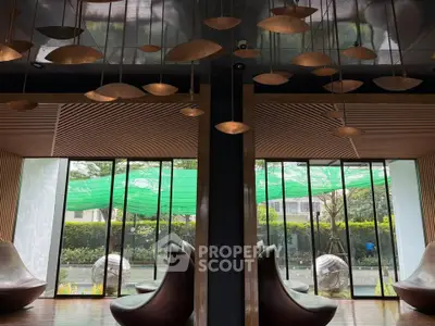 Luxurious modern lounge with unique lighting and garden view