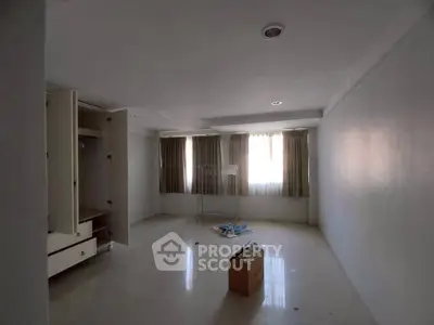Spacious empty room with natural light, ideal for customization and personal design.