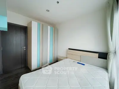 Modern bedroom with stylish wardrobe and natural light