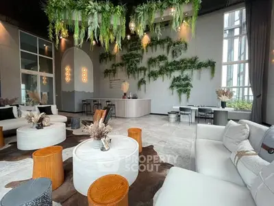 Luxurious modern living room with lush greenery and elegant decor