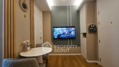 Modern living room with wall-mounted TV and stylish decor