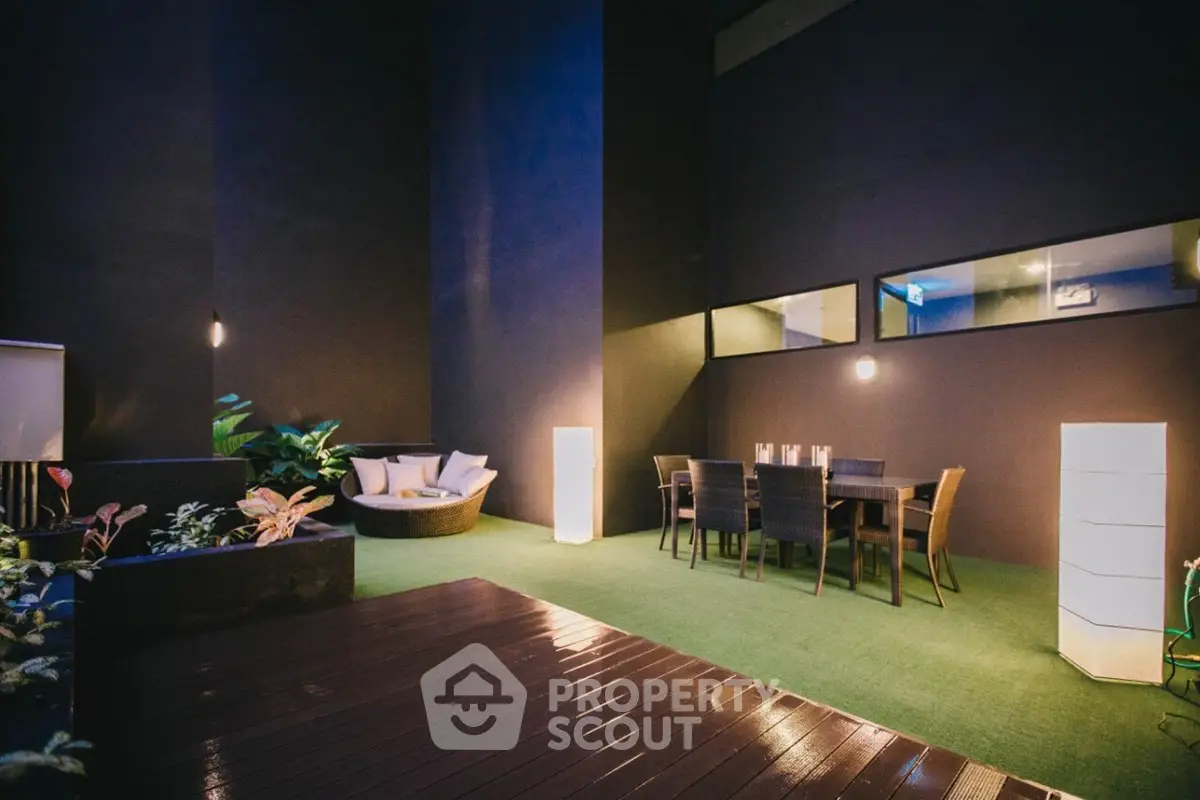Luxurious outdoor patio with modern seating and ambient lighting for elegant gatherings.