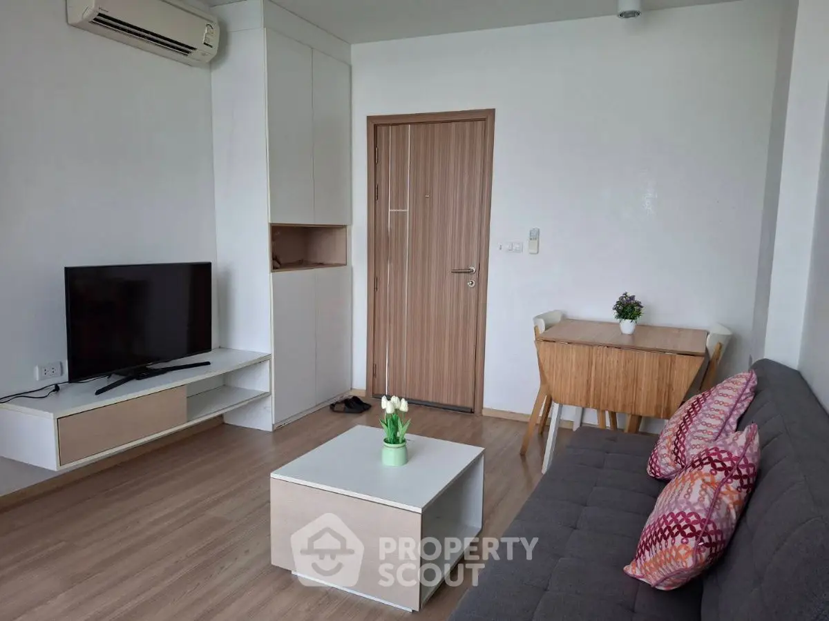 Modern living room with stylish furniture and air conditioning