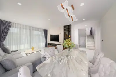 Luxurious modern living room with elegant dining area and stylish decor